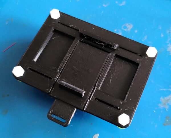 Rear view of a printed DIN rail mount showing the snap clip geometry