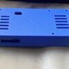 Physical blue ESP32 Power Pack Case with the lid closed and port window visible